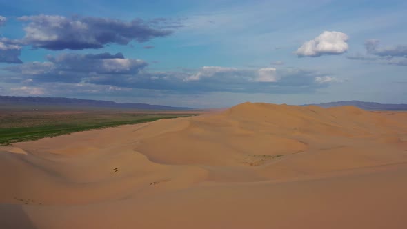 Aerial View of Sand Dunes in Desert at Sunset