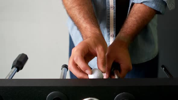 Man playing table football game