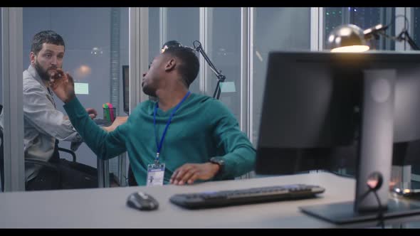 Young Men Working in Data Center