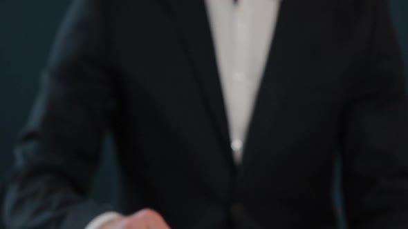 Slow Motion of Male's Midsection in Formal Jacket Holding House Keys in Hand and Showing To Camera