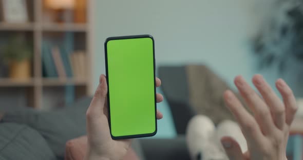 Man Using Green Screen Smartphone for Video Call