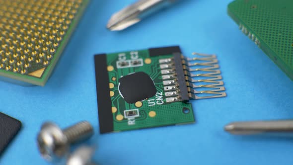 Electronic Green Circuit Board with Microchip and Transistors