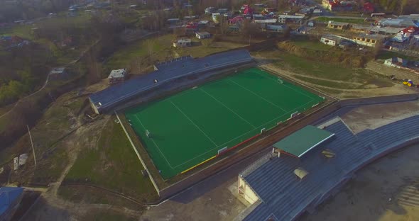 A hockey stadium aerial view in a beautiful town.