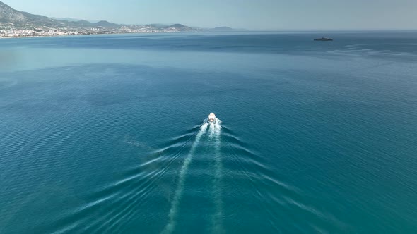 Fishing boat goeas to sea aerial view Turkey Alanya 4 K