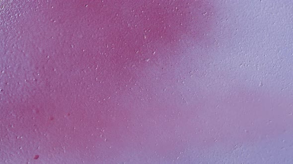 Painting Violet Walls with Pink Purple Paint Using Spray Can Closeup