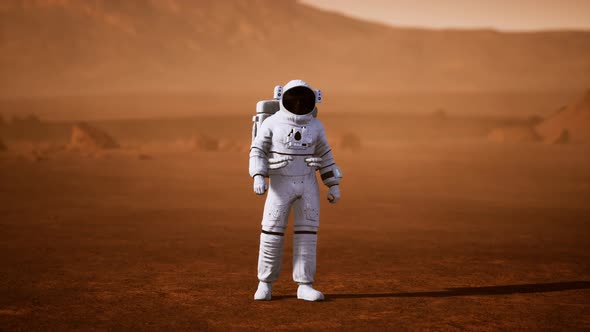 Astronaut on Mars Surface. Red Planet Covered in Gas and Rock