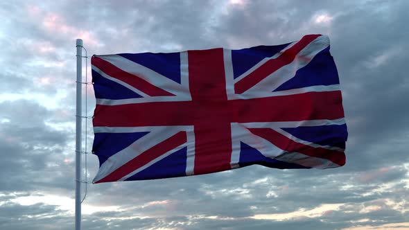 Realistic Flag of United Kingdom Waving in the Wind Against Deep Dramatic Sky. UHD 60 FPS Slow