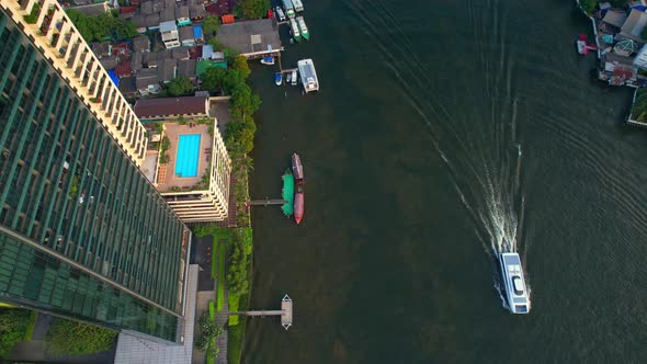 4K : Aerial view of passenger boats moving in Chao Phraya River