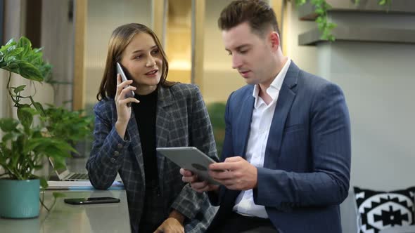 Business People Talking In a Cafe