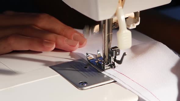 Sew on a White Cloth with Red Thread, Slow Motion