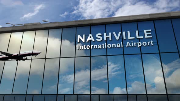 Airplane landing at Nashville Tennessee, USA airport mirrored in terminal