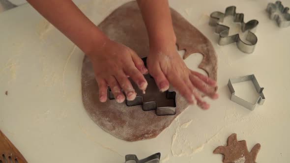 Top View of Child's Hands Making Traditional Christmas Cookies