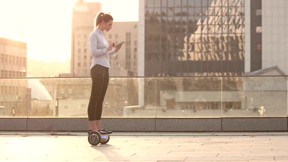 Businesswoman on Sunny City Background