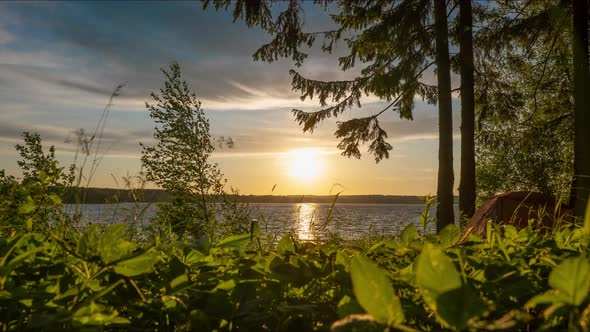 Timelapse  Sunrise with Lake Tent Grass and Clouds