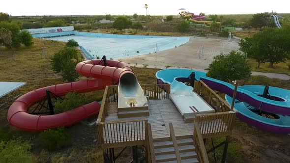 Revealing drone shot of water slides at abandoned waterpark Breakers in Tucson Arizona