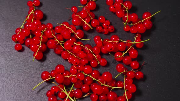 Juicy Red Cranberry on a Black Stone Table