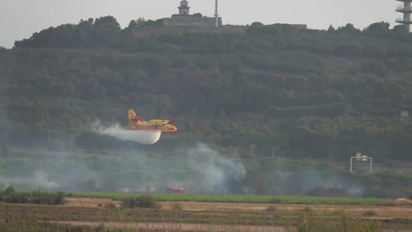 Aircraft Bombardier Dump Water on Fire