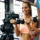 Beautiful Woman Doing Exercises in Gym with Personal Trainer - VideoHive Item for Sale