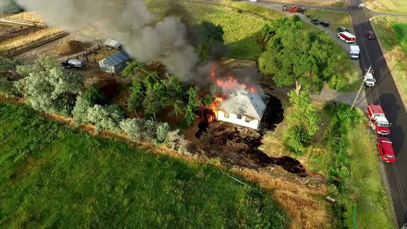 Aerial footage of house burning down