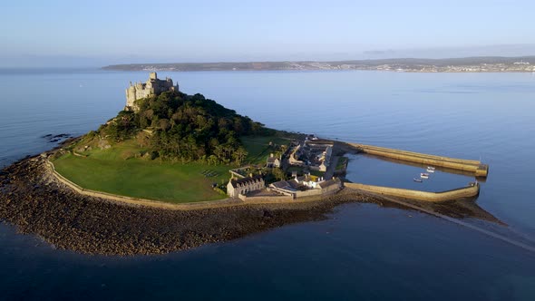 Beautiful and famous St Michaels Mount in Cornwall. Aerial orbit