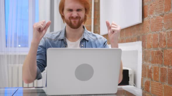 Man Sitting in Office Upset by Loss of Work