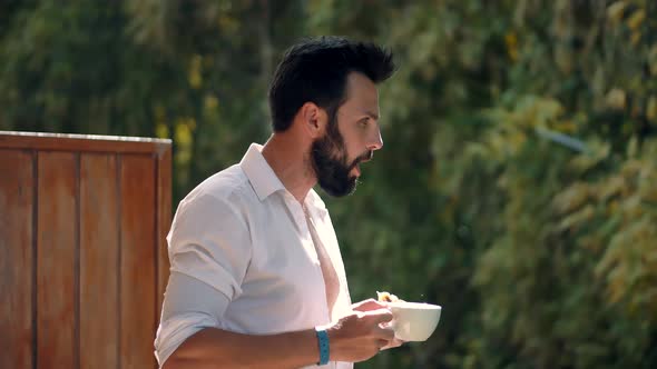 Man In Sunglasses Relaxing In Resort And Having Breakfast. Businessman Drinking Coffee. Caribbean.