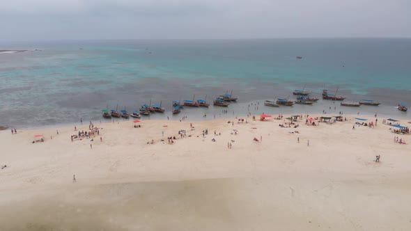 Aerial View Disappearing Island with Tourists and Boats in Menai Bay Zanzibar