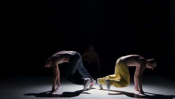 Three Breakdance Dancers with Naked Torso Starts Dance, on Black, Shadow