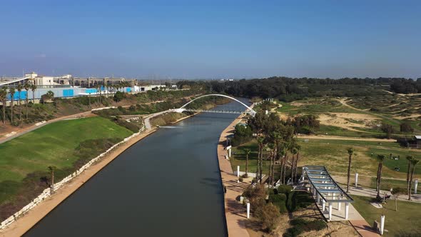 Hadera Park flying over river and modern bridge. The Hadera Water Park, located between Givat Olga a