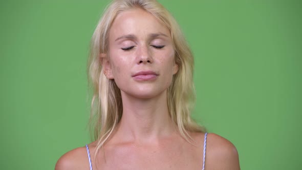 Young Happy Beautiful Businesswoman Relaxing with Eyes Closed