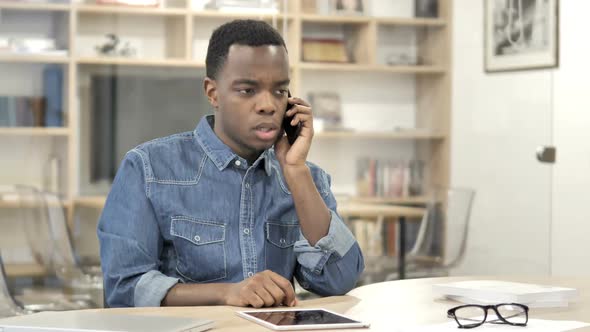 AfroAmerican Designer Talking on Phone