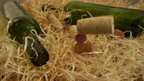 Falling wine corks on straw. Slow motion.