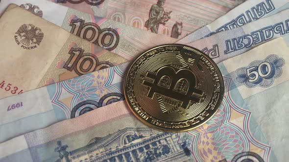 Golden Bitcoin on Russian Rubles Banknotes Cryptocurrency Exchange Concept