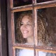 Happy woman inside home smile and enjoy viewed through the glass windows from outside - VideoHive Item for Sale