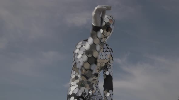 Sparkling Discosuit Man Dancing with Clouds Behind