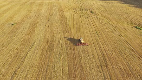 Aerial Footage of Tractor Sowing Rapeseed