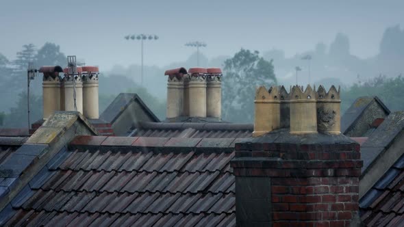 Chimneys On Rooftops In The Rain