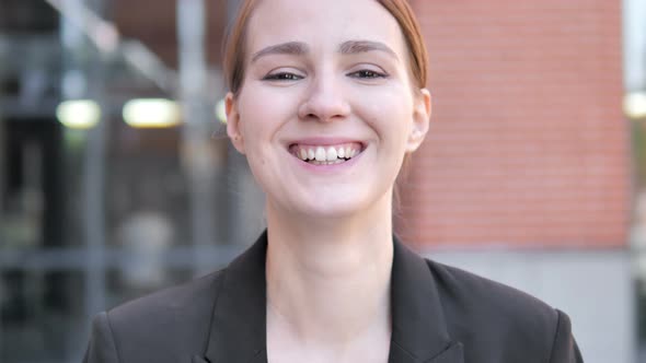 Outdoor Close up of Smiling Young Businesswoman