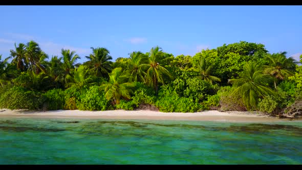 Aerial drone view tourism of tranquil tourist beach holiday by aqua blue lagoon and white sand backg