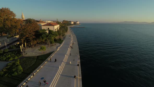 Aerial view of a sea waterfront in the evening