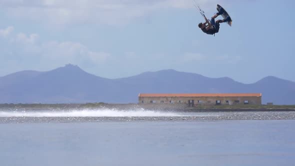 A man kiteboarding on a kite board.