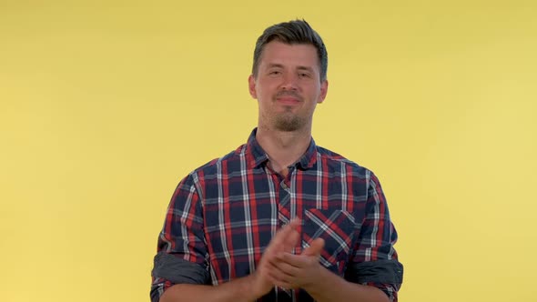 Close-up of Handsome Man in Checkered Shirt Clapping His Hands