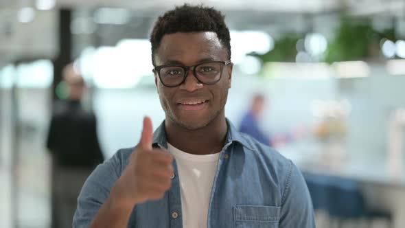 Portrait of Young African Man Showing Thumbs Up Sign