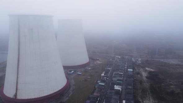 Aerial View From a Drone to a Thermal Power Plant in Cloudy Foggy Weather