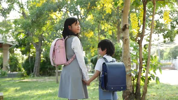 Cute Asian Children Going To The School Outdoors