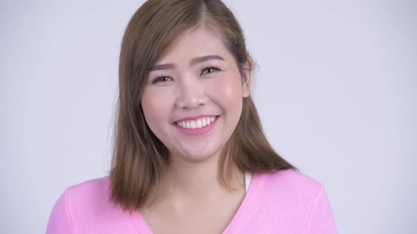Face of Young Happy Asian Woman Smiling