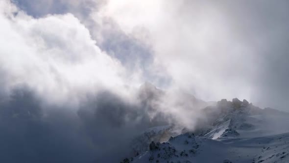 Fog Over The Snowy Mountains