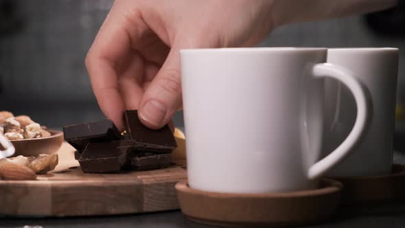 Fresh Coffee in Two White Mugs Is on Table and Steam Comes From It