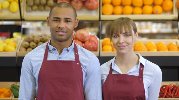 Cheerful Diverse Shop Clerks at Grocery Store