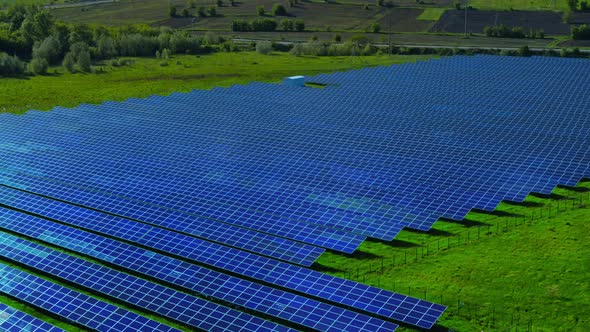 Aerial View of Blue Solar Panels on Nature Background